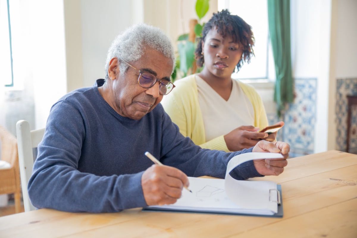 Caregiver and older adult in supportive conversation